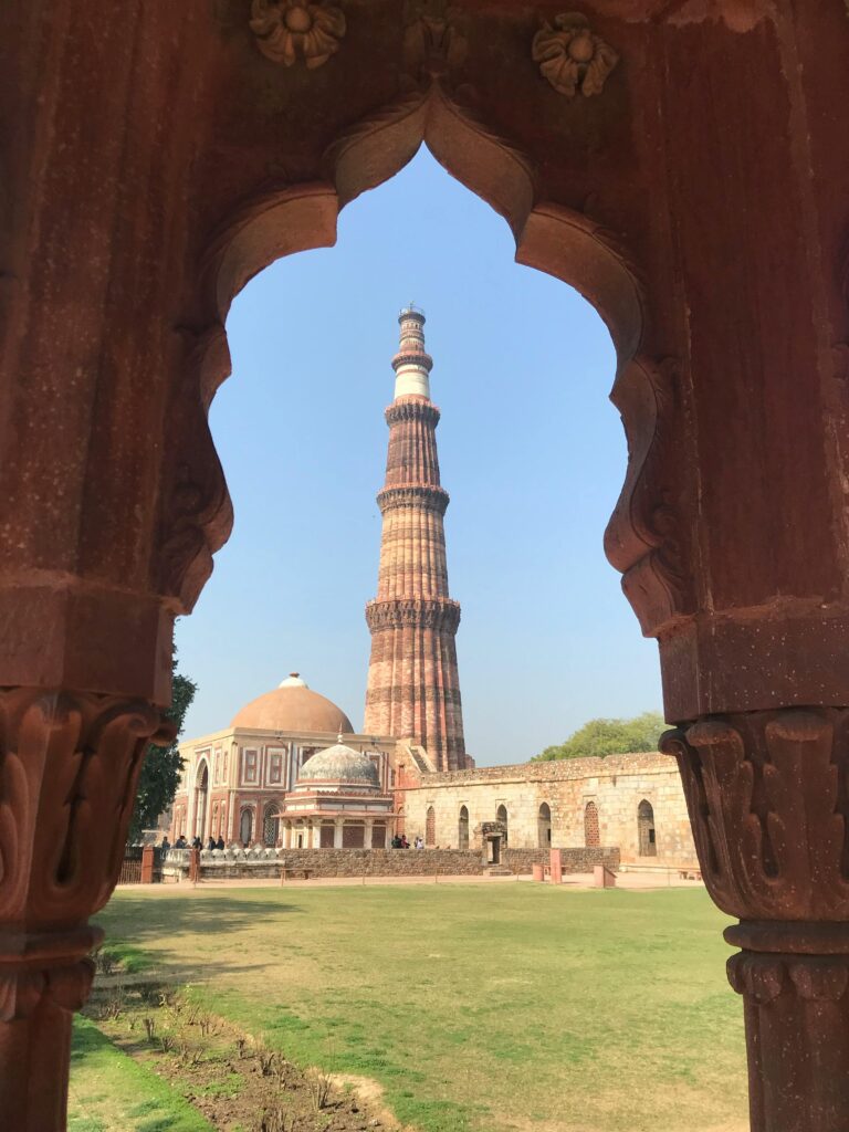  Qutub Minar tall red sandstone tower with intricate carvings in Delhi