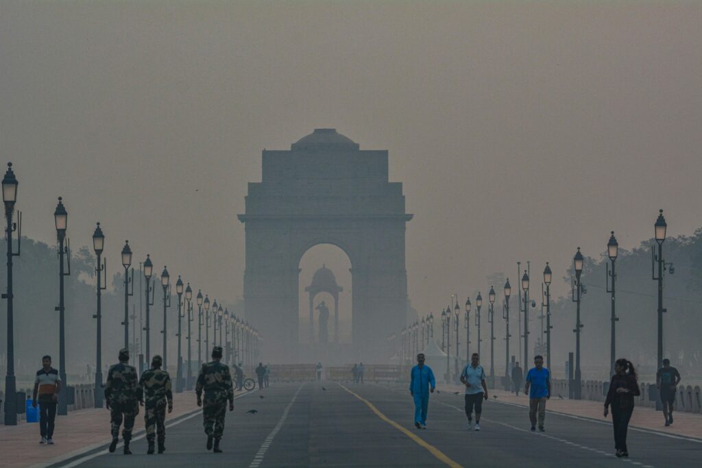  India Gate with and friends walking and relaxing near the monument in Delhi