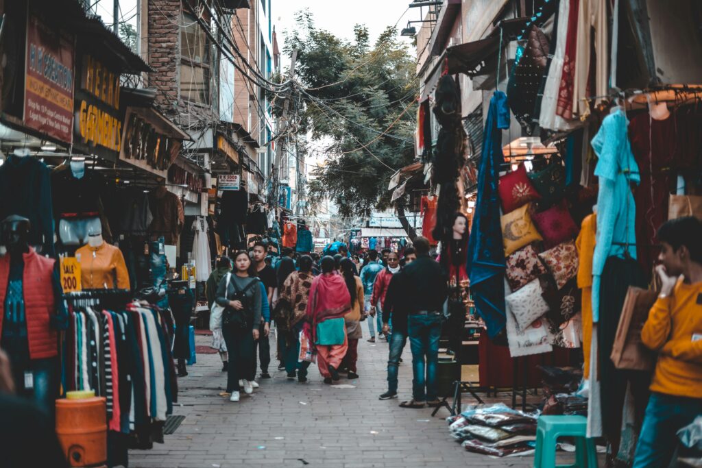  Sarojini Nagar Market crowded shopping area with people exploring stalls in Delhi